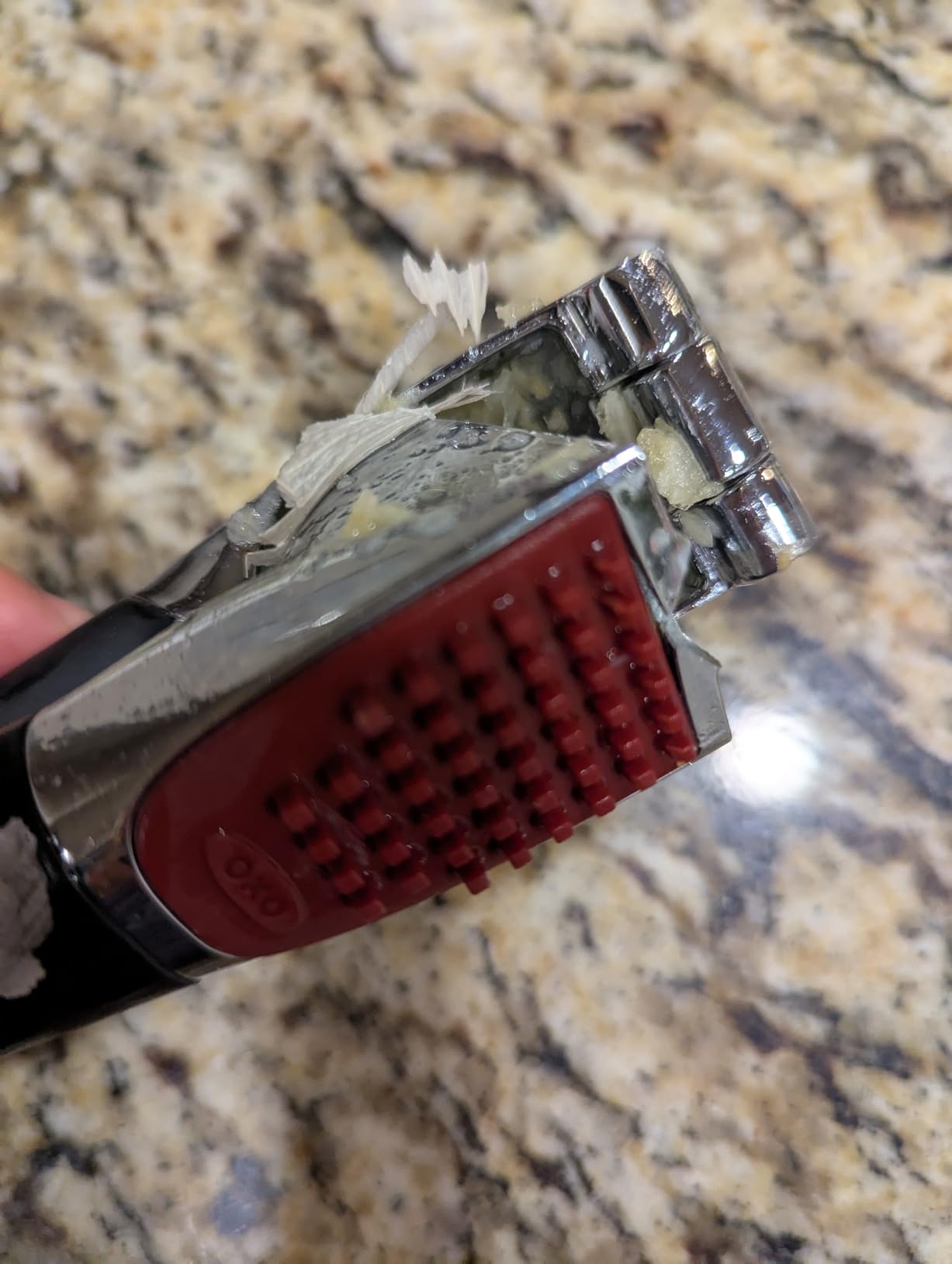 OXO Good Grips Garlic Press, Easy to squeeze & Self Cleaning Tool, Black customer photo 2