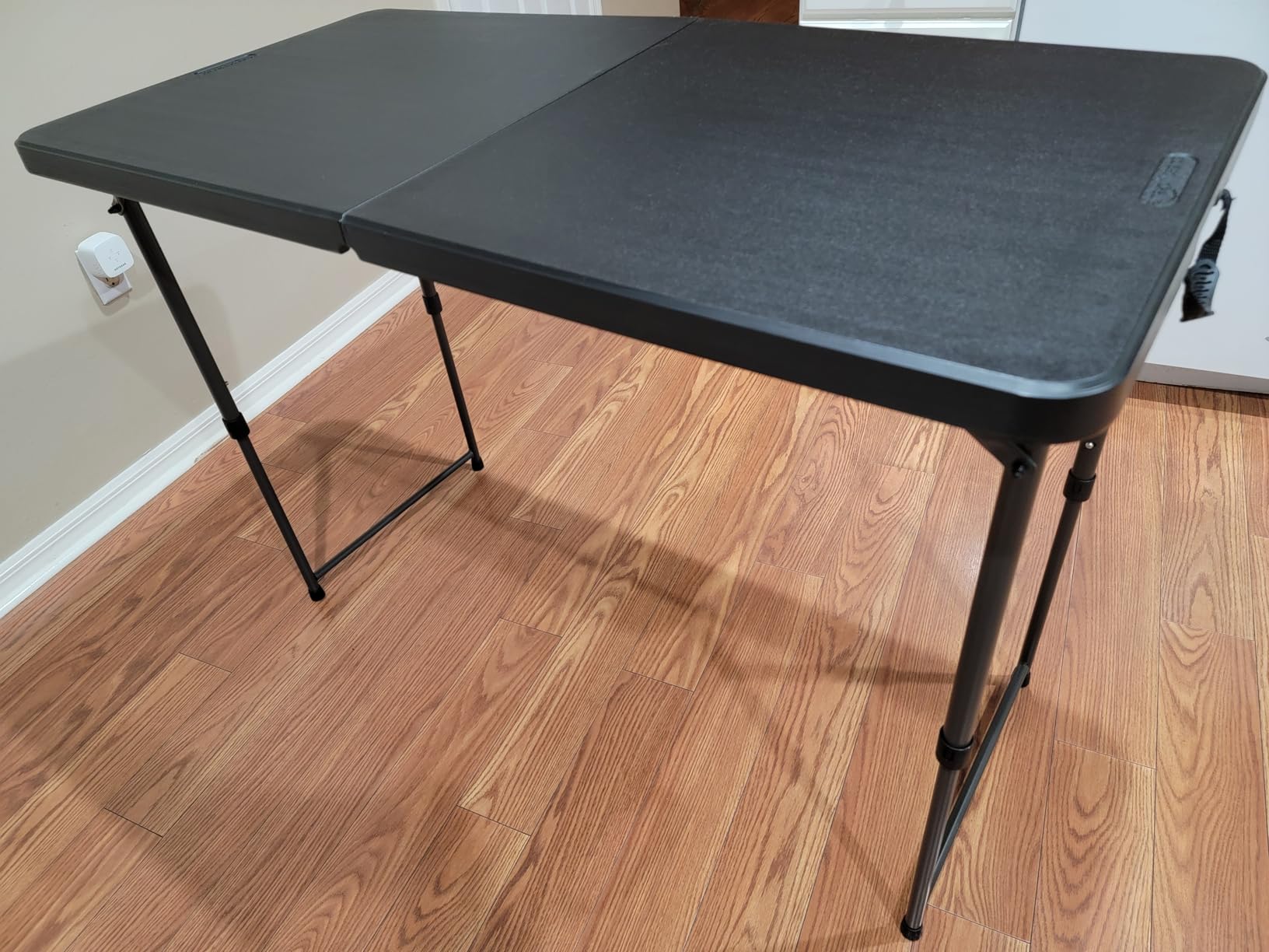 Amazon Basics 4 Foot Rectangular Folding Dining Table, 4 Adjustable Height Settings with Carrying Handle, Indoor & Outdoor, Washed Black, 47.8 x 23.9 x 33.9 in Customer Review Amazon Basics 4 Foot Rectangular Folding Dining Table, 4 Adjustable Height Settings with Carrying Handle, Indoor & Outdoor, Washed Black, 47.8 x 23.9 x 33.9 in - Customer Photo 2