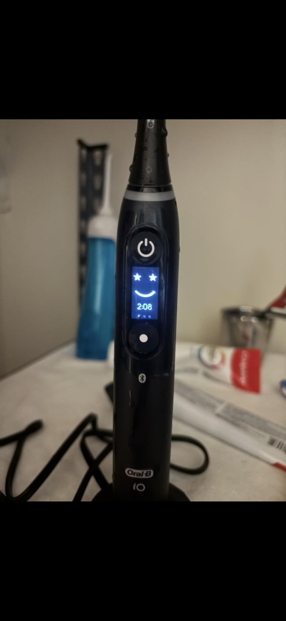 Oral-B iO Deep Clean + Protect Rechargeable Electric Toothbrush, Black, iO Series 7, 2 Replacement Brush Heads, Charging Travel Case (package may vary) customer photo 1