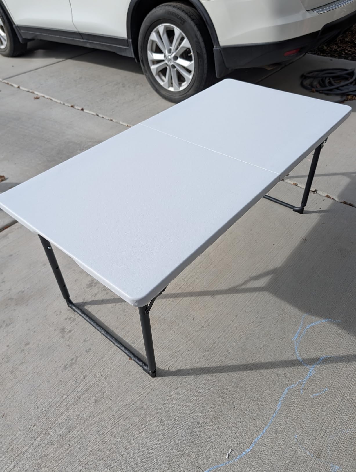 Folding Table 4ft - Heavy Duty Fold-in-Half Plastic Table with Adjustable Height, Portable Utility Tables with Steel Legs for Indoor, Outdoor, Picnic, Camping, Dining, Party (White) Customer Review Folding Table 4ft - Heavy Duty Fold-in-Half Plastic Table with Adjustable Height, Portable Utility Tables with Steel Legs for Indoor, Outdoor, Picnic, Camping, Dining, Party (White) - Customer Photo 1