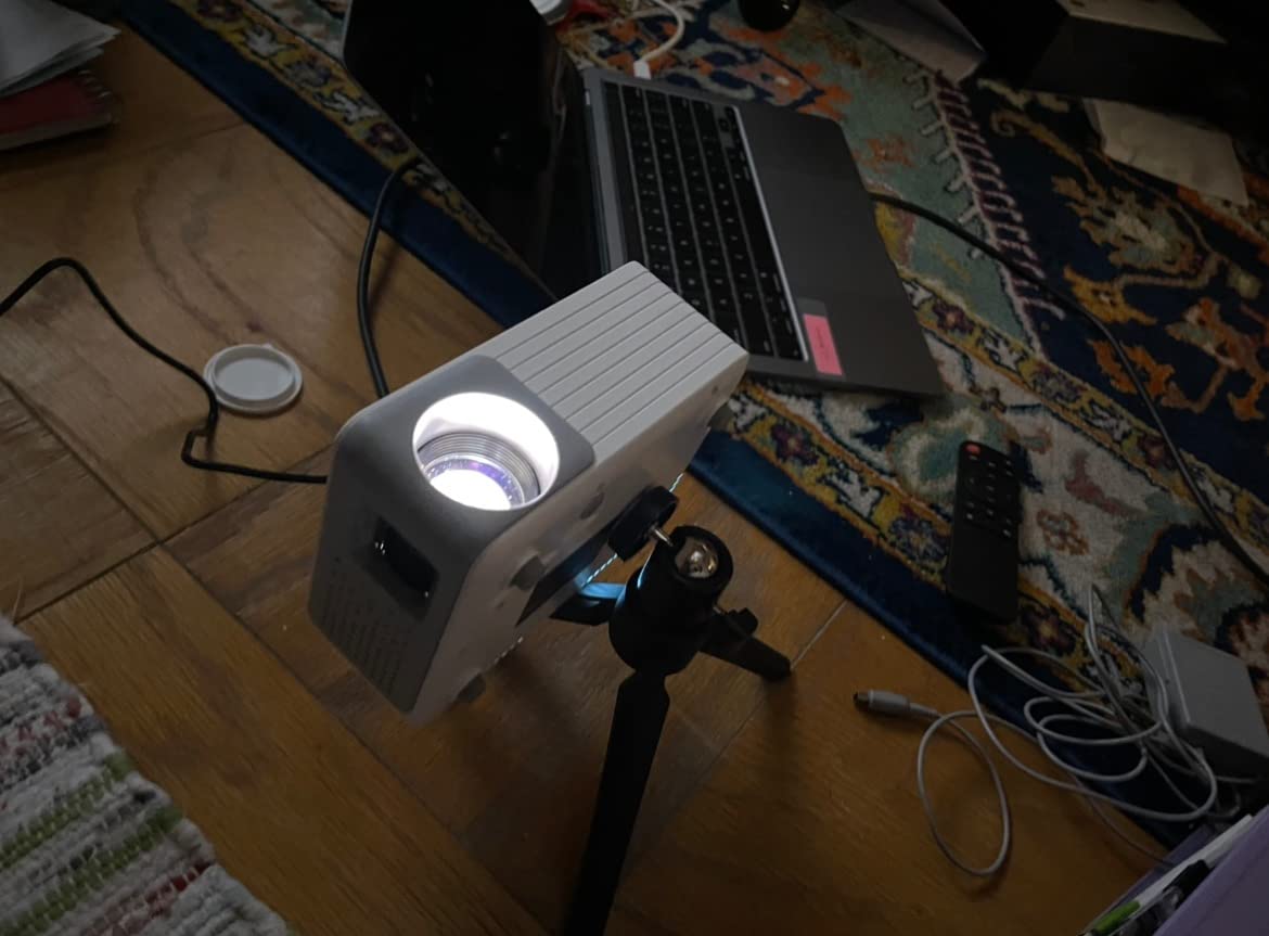Mini Projector with WiFi and Bluetooth, AKIYO 2026 Upgraded Projector 1080P | Auto Keystone, 360° Rotating, Portable Projector customer photo 1