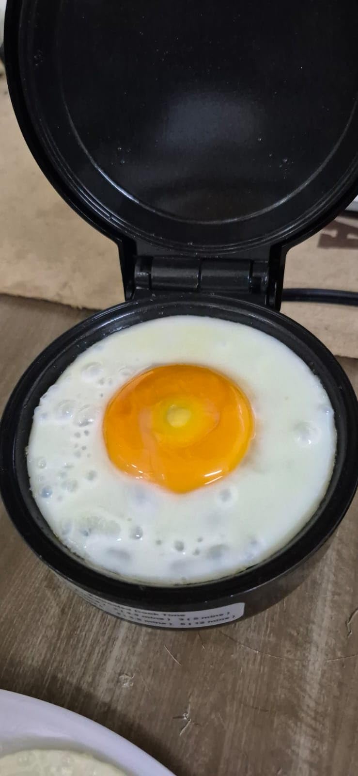 Hyvance Smart Fried Egg Cooker, Automatic Fried Egg Maker for 6 Features like Sunny Side Up, Over Easy, Fully Cooked & More. Auto Power Off, Alarm, Round Shape, Non Stick Coating (Black) customer photo 1